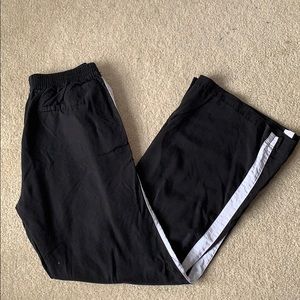 Black, wide leg track pants w/ white side stripe